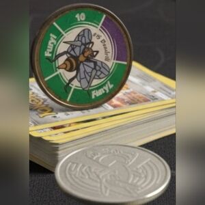 (Lot Of 2) Pokémon TCG Coins: (1) Colored Beedrill Coin & (1) Silver Lugia Coin.